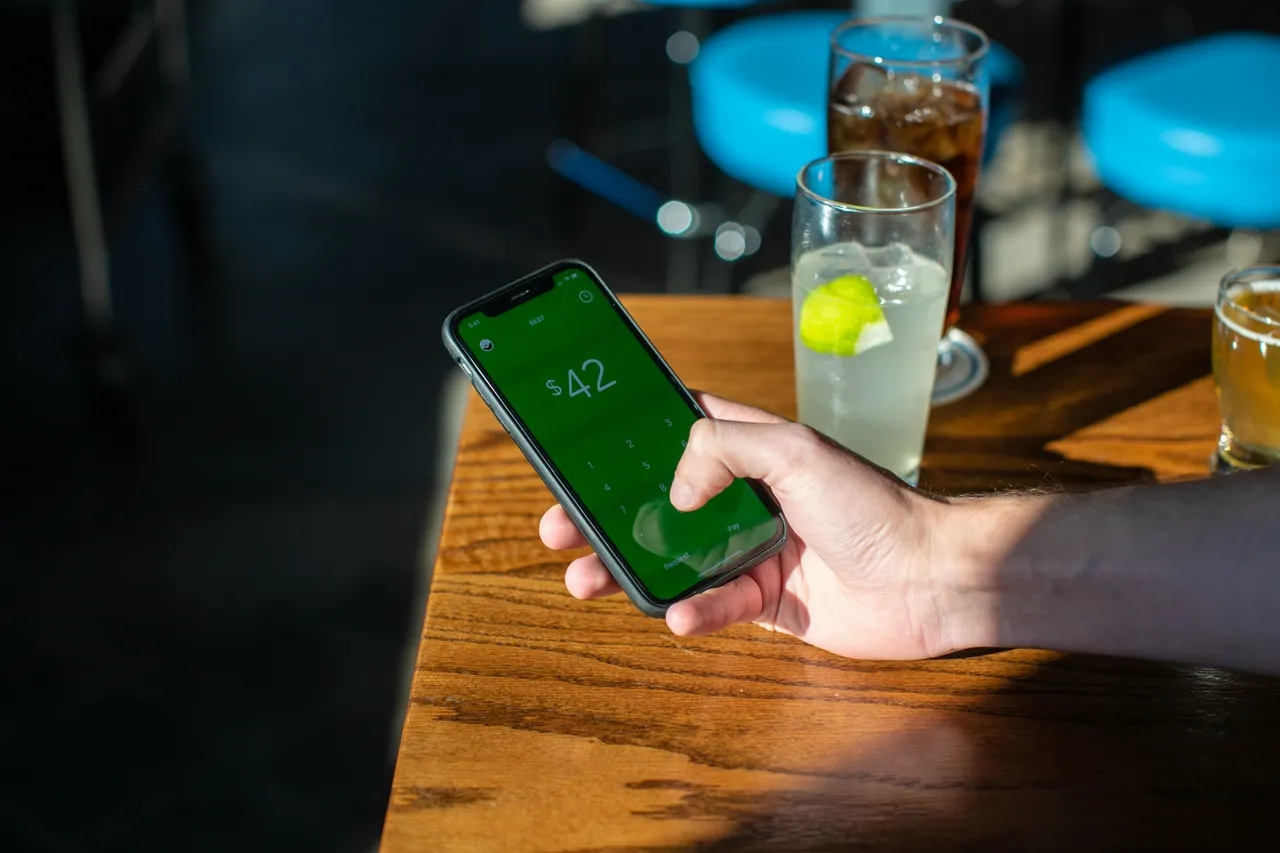 Man making a trade on his phone